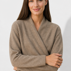 Light pink cashmere V-neck sweater for women, featuring a relaxed fit and soft texture from Christine Brewer's Gwen collection.