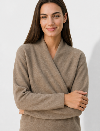 Light pink cashmere V-neck sweater for women, featuring a relaxed fit and soft texture from Christine Brewer's Gwen collection.