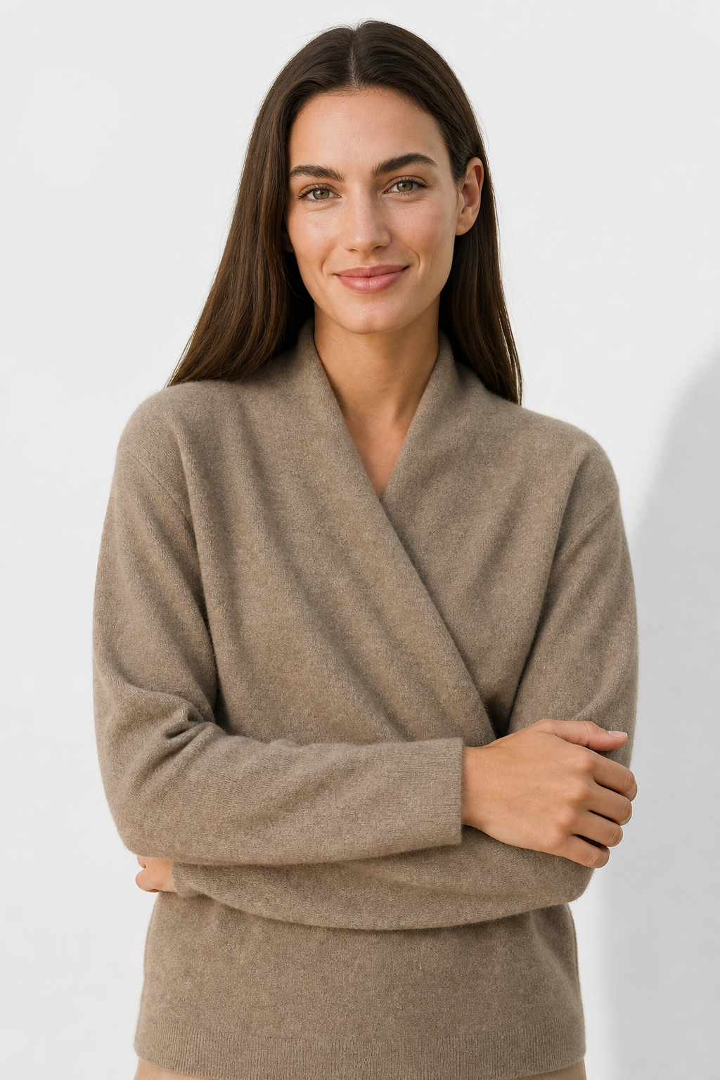 Light pink cashmere V-neck sweater for women, featuring a relaxed fit and soft texture from Christine Brewer's Gwen collection.