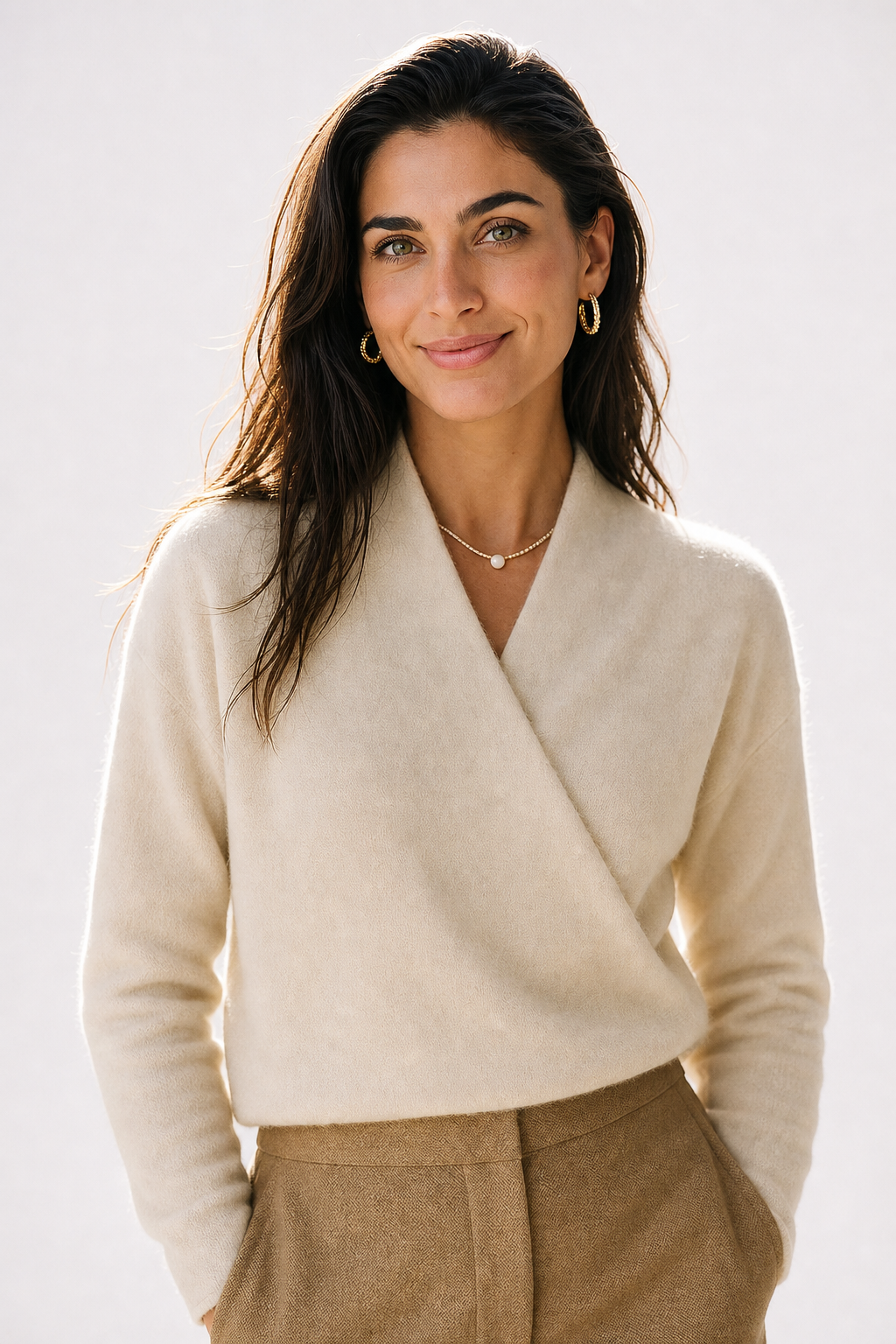 Cream-colored Christine Brewer Gwen Cashmere V-Neck Sweater for women, soft knit fabric, close-up of the cozy sweater.