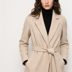 Olivia long belted wool coat for women by Christine Brewer, featuring a classic design and tailored fit, shown on a model.