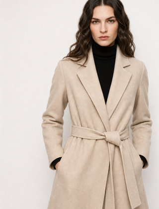 Olivia long belted wool coat for women by Christine Brewer, featuring a classic design and tailored fit, shown on a model.