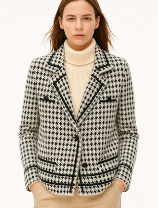 Isabella Christine Brewer women's cropped double-breasted knit cardigan with long sleeves and button details, in soft neutral tones.