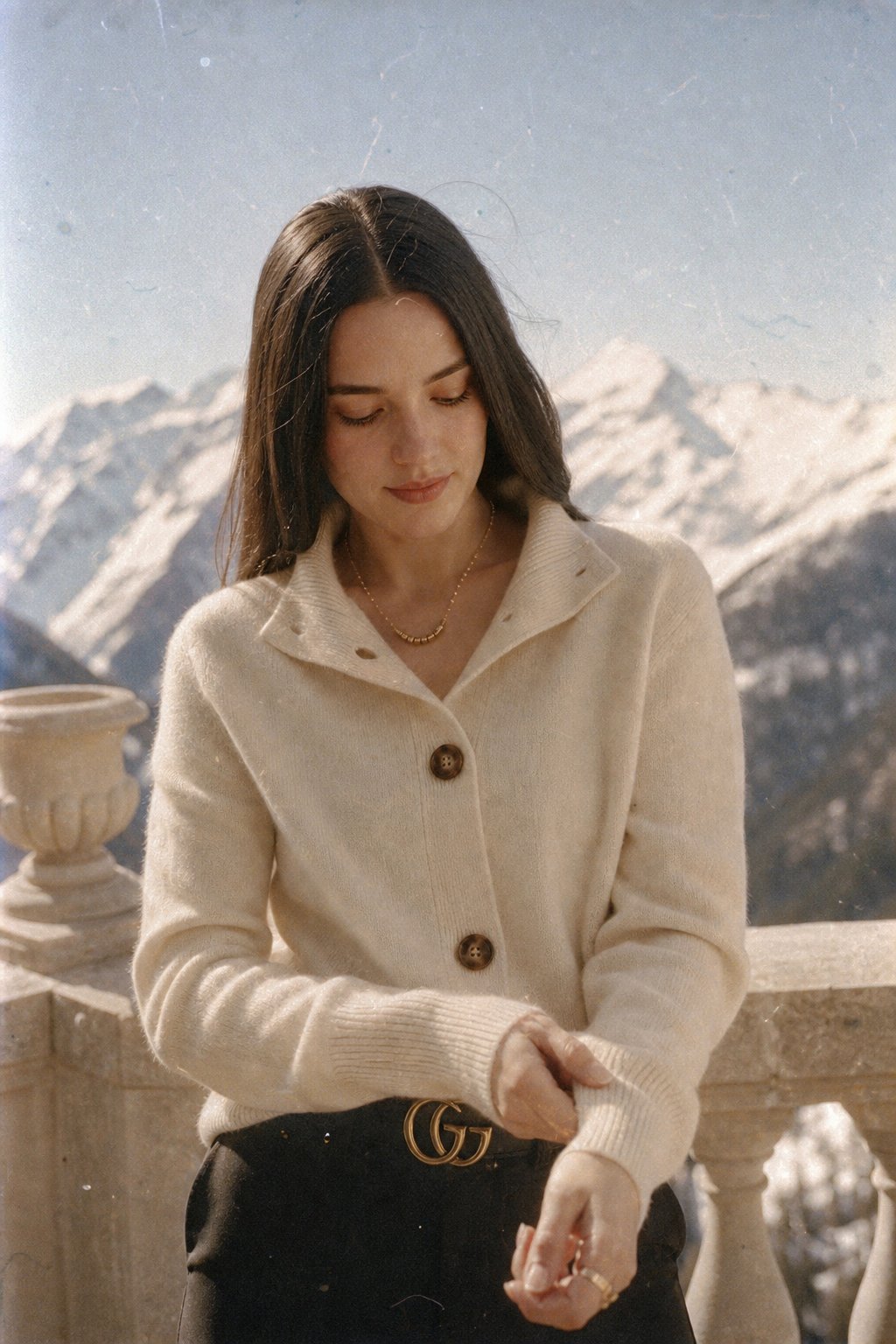 Christina Christine Brewer women's cashmere high neck cardigan, soft beige color, close-up of knit fabric and high neckline.