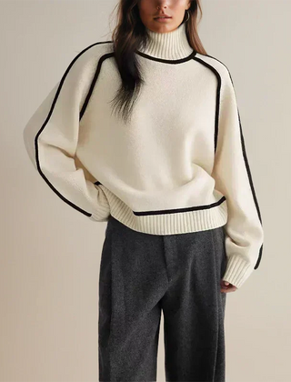 Christine Brewer Eva loose fit roll neck sweater in tailored chic style, soft knit fabric, shown in a relaxed fit and neutral color.