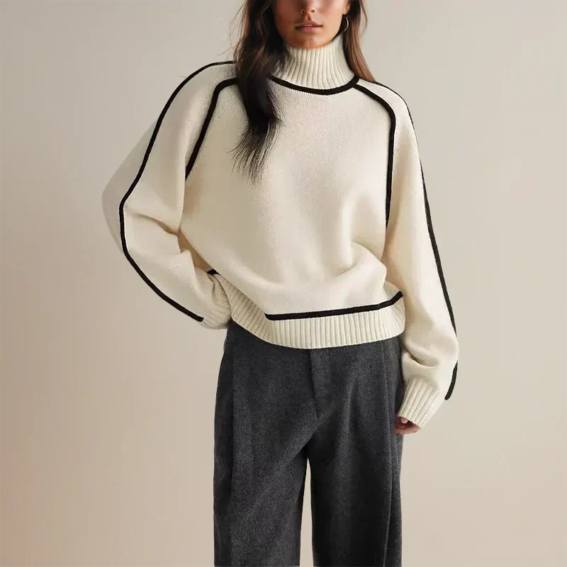 Christine Brewer Eva loose fit roll neck sweater in tailored chic style, soft knit fabric, shown in a relaxed fit and neutral color.