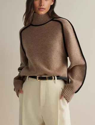 Christine Brewer Eva loose fit roll neck sweater in soft knit fabric, tailored chic style, shown in a relaxed fit on a model.