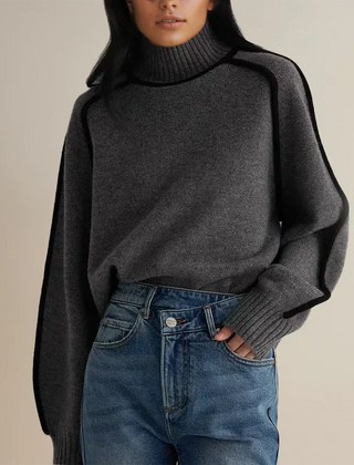 Christine Brewer Eva loose fit roll neck sweater, tailored chic clothing in soft fabric, shown in a relaxed, stylish fit.