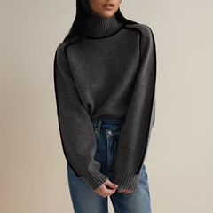 Christine Brewer Eva loose fit roll neck sweater in a tailored chic style, shown in a natural fabric and relaxed fit.