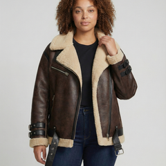 Black faux leather moto jacket for women by Christine Brewer featuring a classic collar and silver zipper details.