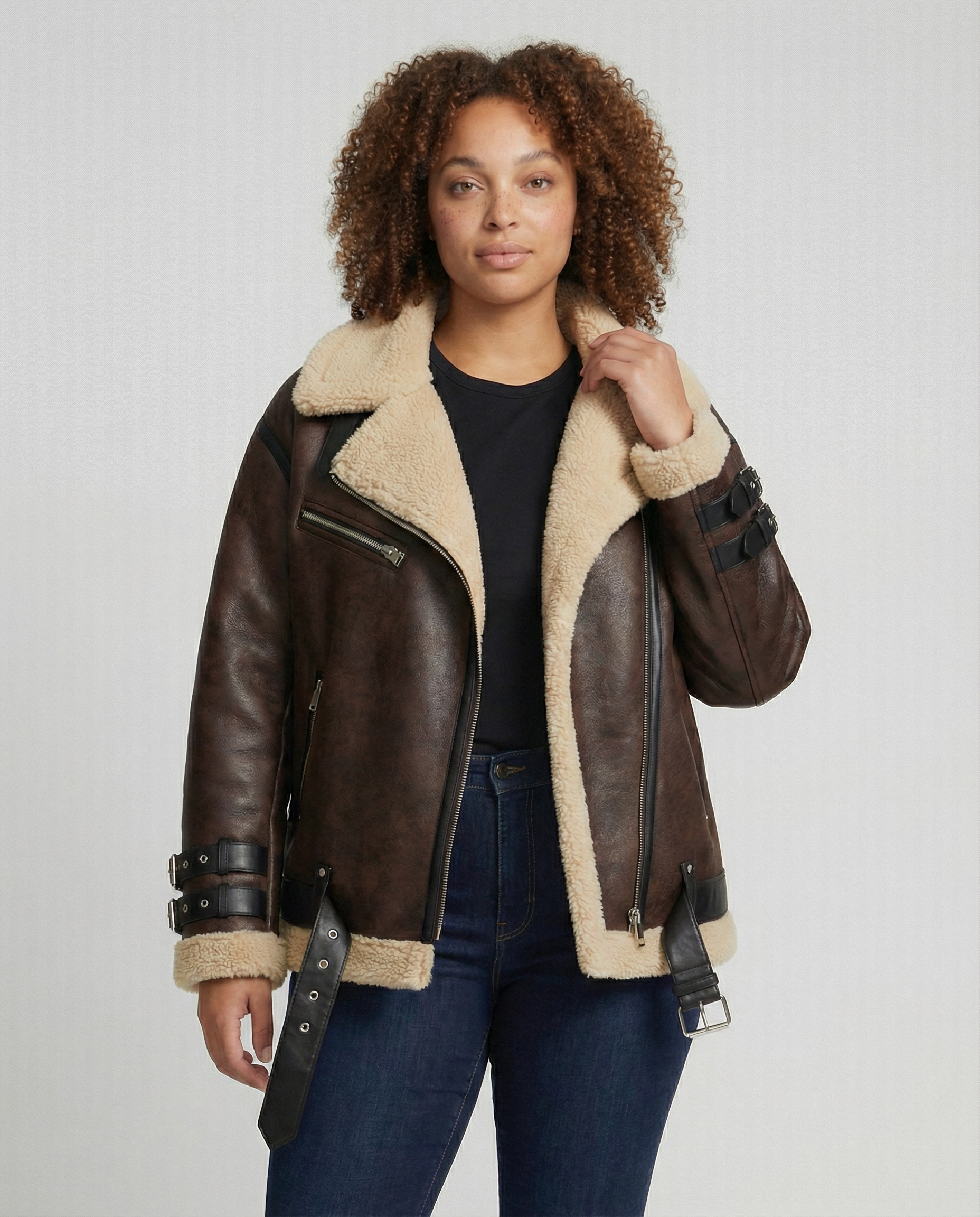 Black faux leather moto jacket for women by Christine Brewer featuring a classic collar and silver zipper details.