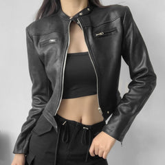 Isla cropped faux leather jacket for women by Christine Brewer, displayed on a hanger showing its fitted style and smooth leather texture.