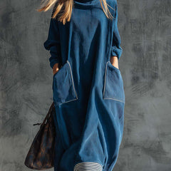 Blue corduroy midi dress by Christine Brewer featuring a casual style, with a fitted bodice and flowing skirt.