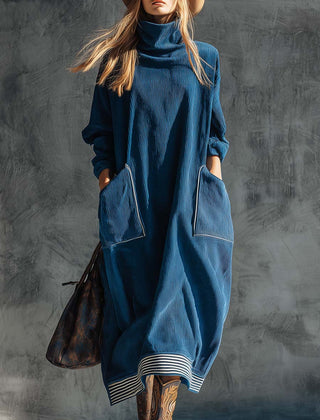 Blue corduroy midi dress by Christine Brewer featuring a casual style, with a fitted bodice and flowing skirt.