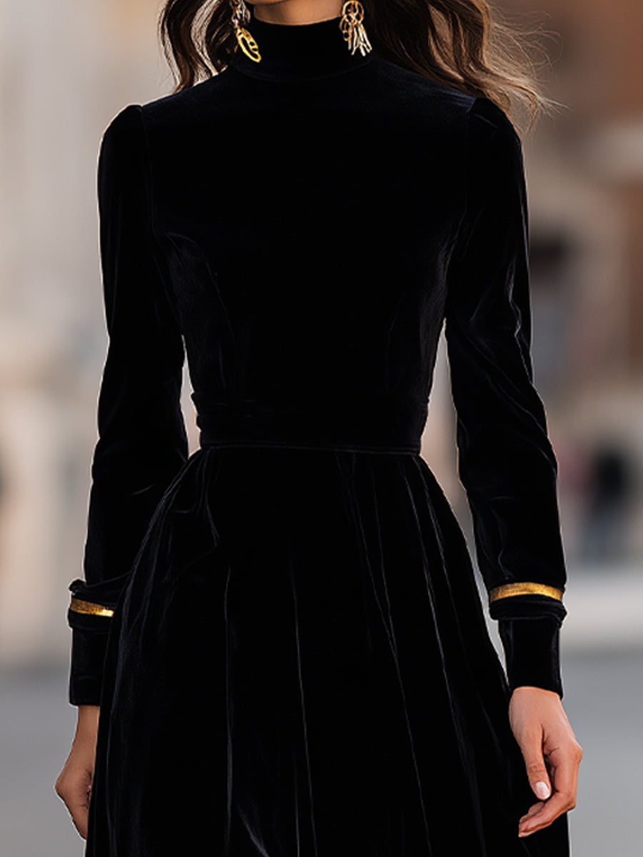 Elegant velvet midi dress with gold trim by Christine Brewer, featuring a fitted bodice and flowing skirt.