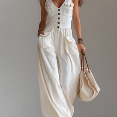 White sleeveless wide-leg jumpsuit with patch pockets for women, stylish and comfortable by Christine Brewer.