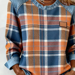 Genevieve patchwork sweatshirt for women by Christine Brewer, showing colorful patchwork design and cozy hooded style.