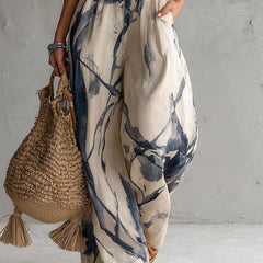 White ink wash print halter neck wide-leg jumpsuit for women with pockets, by Christine Brewer, featuring a stylish and comfortable design.