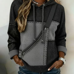 Christine Brewer Isla colorblock long sleeve hoodie featuring a chic, elegant design with contrasting color panels and a comfortable fit.