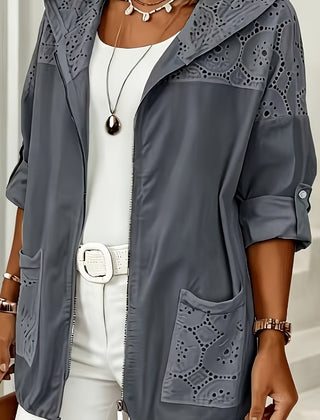 Women’s Iris hooded jacket by Christine Brewer, showing a stylish jacket with a hood, front zipper, and practical design.