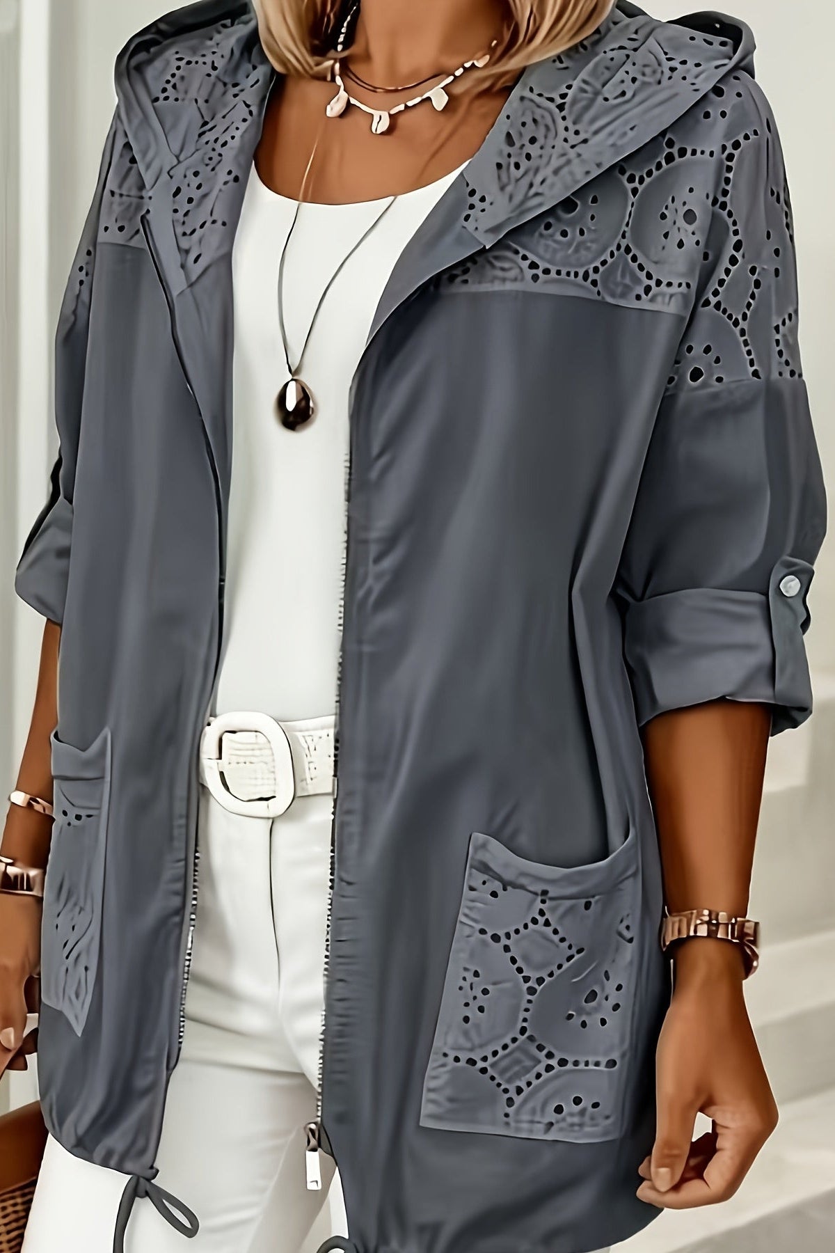 Women’s Iris hooded jacket by Christine Brewer, showing a stylish jacket with a hood, front zipper, and practical design.