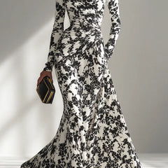 Black and white color-blocked printed long-sleeve maxi dress with pockets, slim fit, pleated design by Christine Brewer.