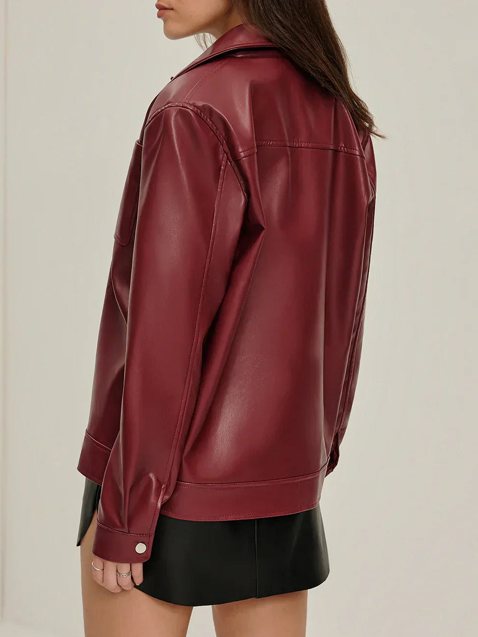 Bianca zip-up faux leather jacket for women by Christine Brewer, featuring a stylish design with a front zipper and fitted silhouette.