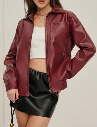 Burgundy zip-up faux leather jacket for women by Christine Brewer, featuring a stylish collar and fitted design.