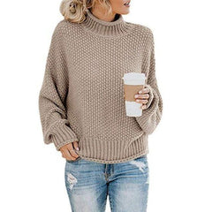 Khaki knit turtleneck sweater by Christine Brewer, cozy boho-style pullover with loose fit and textured knit pattern.