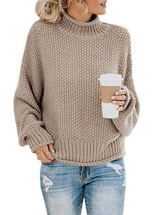 Khaki knit turtleneck sweater by Christine Brewer, cozy boho-style pullover with loose fit and textured knit pattern.