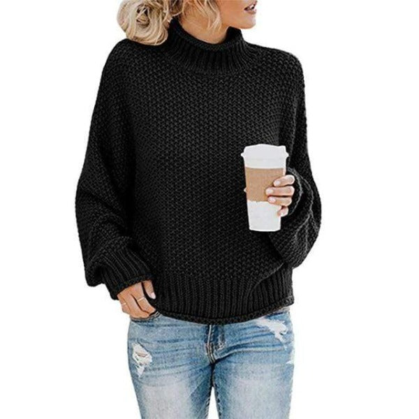 Black Lola turtleneck sweater for women by Christine Brewer, featuring a loose fit and cozy knit design.