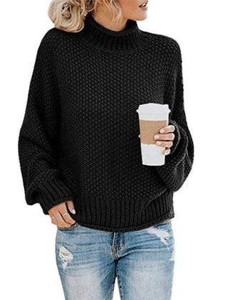 Black Stella Chic Cozy Turtleneck Sweater by Christine Brewer, featuring a loose, boho-inspired knit design.