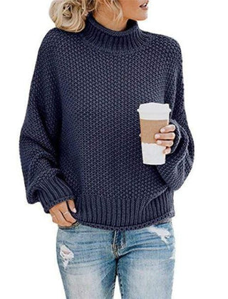 Navy blue Lola turtleneck sweater for women by Christine Brewer, featuring a loose knit boho style.