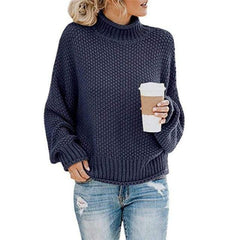 Navy blue Stella cozy turtleneck sweater by Christine Brewer, featuring a loose knit boho beach hut style.