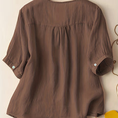 Light beige women's summer blouse by Christine Brewer featuring a V-neck and flowy linen fabric, casual and breathable top.