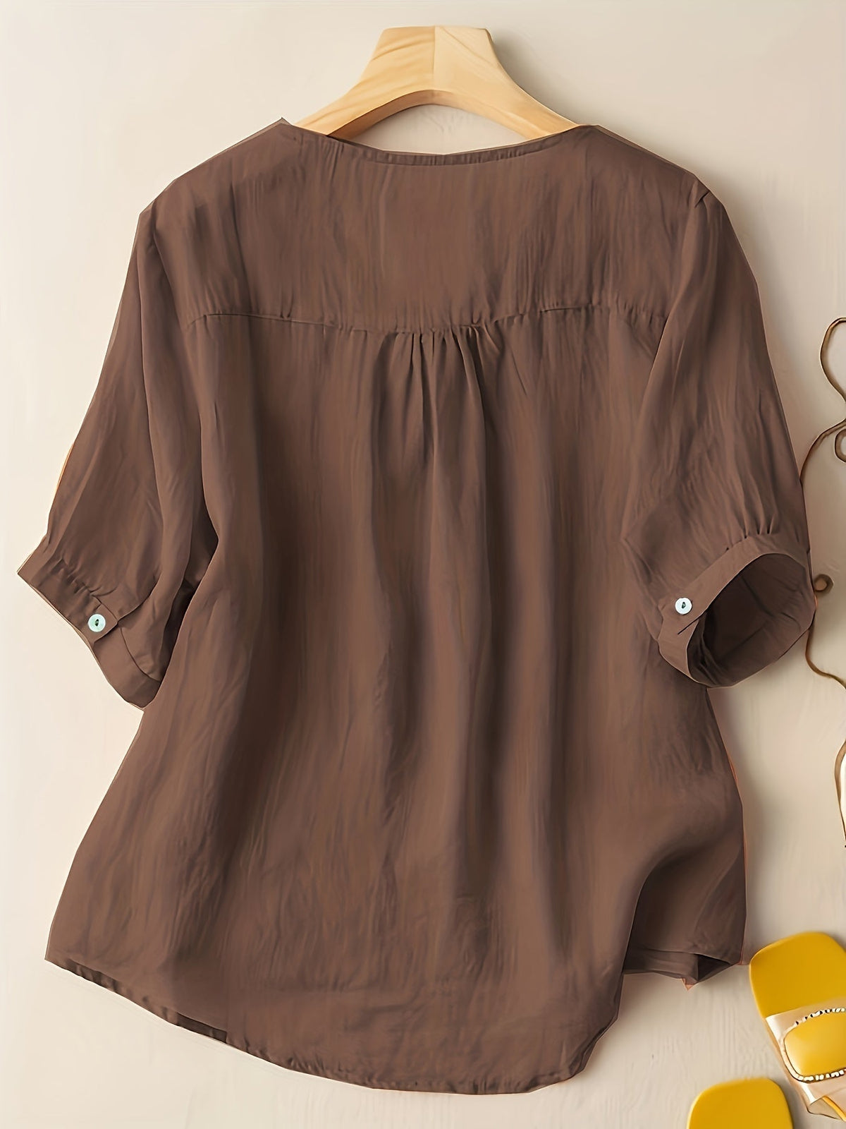 Light beige women's summer blouse by Christine Brewer featuring a V-neck and flowy linen fabric, casual and breathable top.