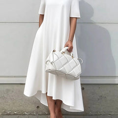 White high-low maxi dress by Christine Brewer featuring short sleeves and a solid color design.