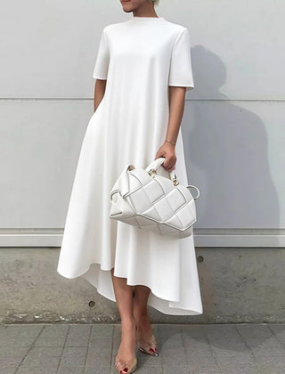 White high-low maxi dress by Christine Brewer featuring short sleeves and a solid color design.
