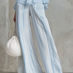 Light blue striped chiffon wide-leg women’s pants by Christine Brewer, flowing and stylish for casual or dressy occasions.