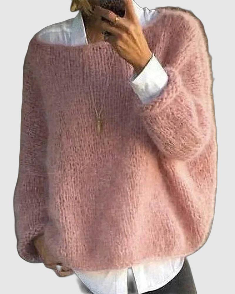 Cream-colored oversized fluffy sweater for women by Christine Brewer, featuring a cozy, plush knit texture and relaxed fit.