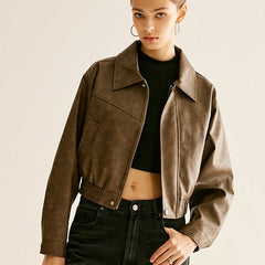 Ruby faux leather moto jacket for women by Christine Brewer, featuring a classic biker style with silver hardware and fitted silhouette.