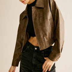 Ruby faux leather moto jacket for women by Christine Brewer, featuring a classic biker style with silver hardware.