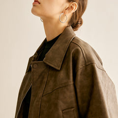 Ruby faux leather moto jacket for women by Christine Brewer, featuring a sleek black biker design with silver hardware.