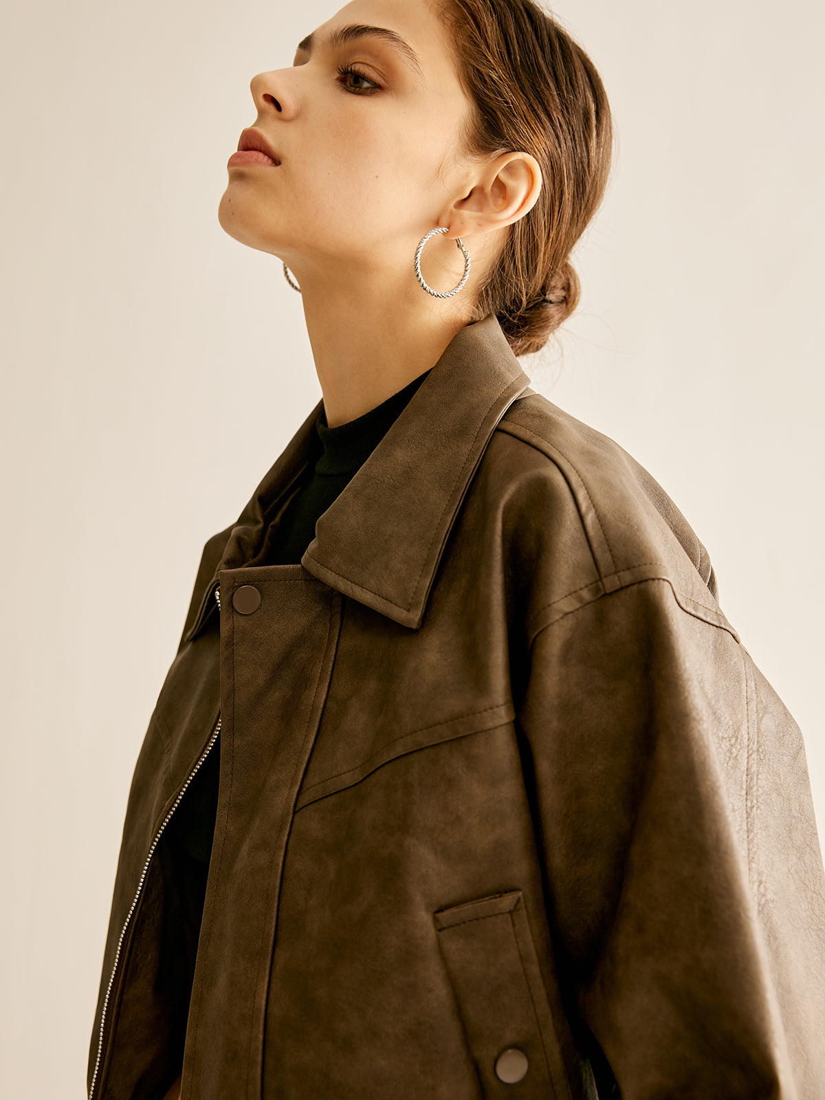 Ruby faux leather moto jacket for women by Christine Brewer, featuring a sleek black biker design with silver hardware.
