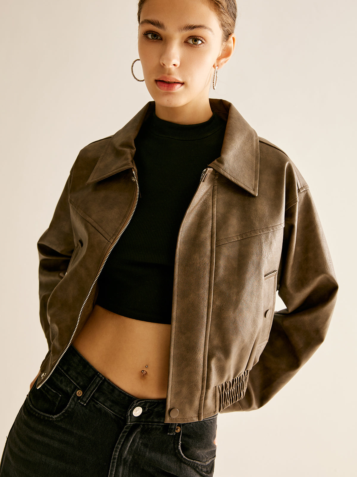 Brown faux leather moto jacket for women by Christine Brewer, featuring classic biker style and stylish detailing.