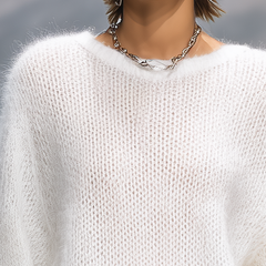 Christine Brewer solid color round neck loose sweater, cozy pullover with a relaxed fit and soft fabric, shown in a neutral tone.