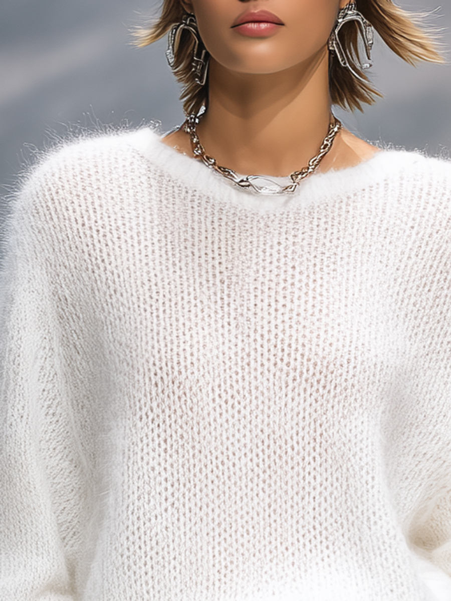 Christine Brewer solid color round neck loose sweater, cozy pullover with a relaxed fit and soft fabric, shown in a neutral tone.