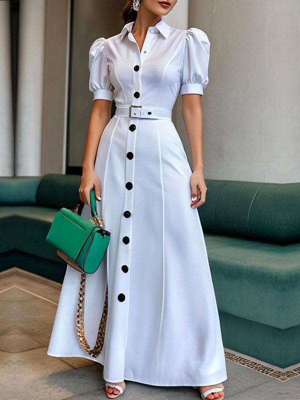 White Christine Brewer maxi dress with puff short sleeves, belted waist, button details, and lapel collar, perfect for elegant summer wear.