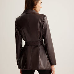 Celeste Zoe belted faux leather jacket for women from Christine Brewer, featuring a stylish design and adjustable waist belt.
