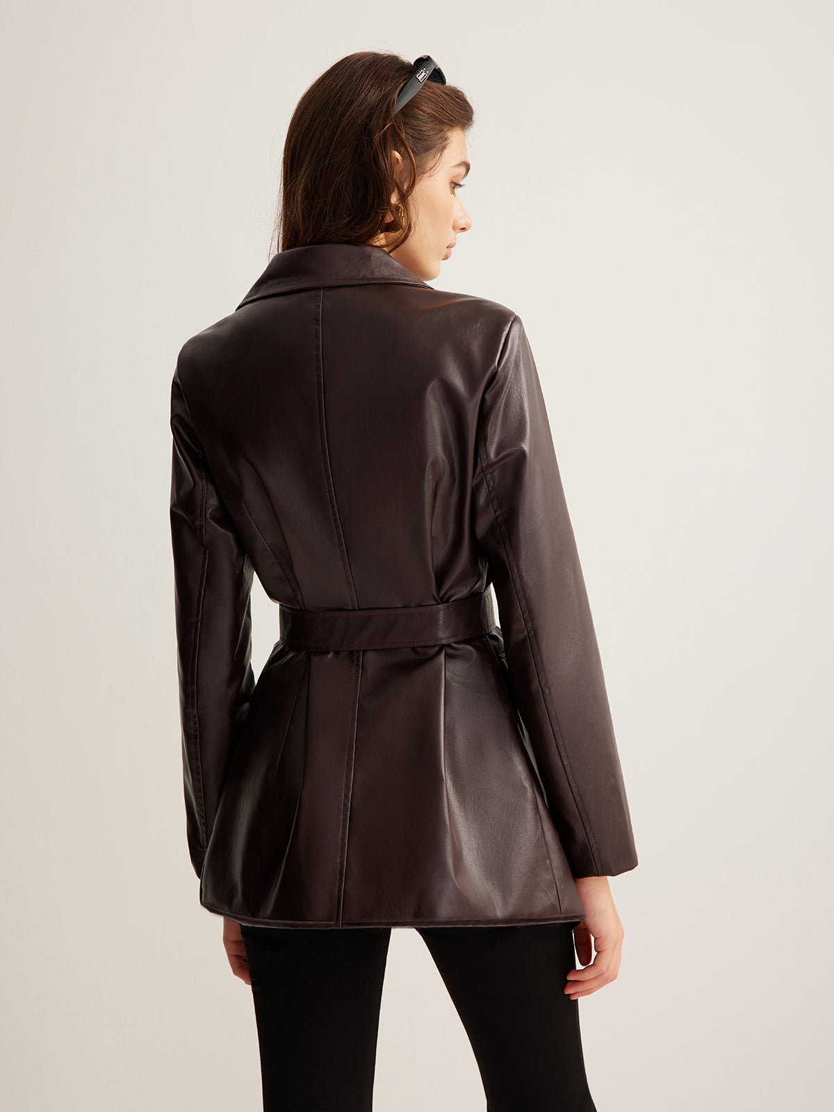 Celeste Zoe belted faux leather jacket for women from Christine Brewer, featuring a stylish design and adjustable waist belt.